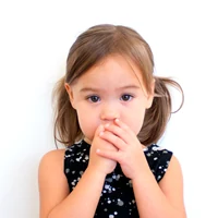 Child covering the mouth with hands